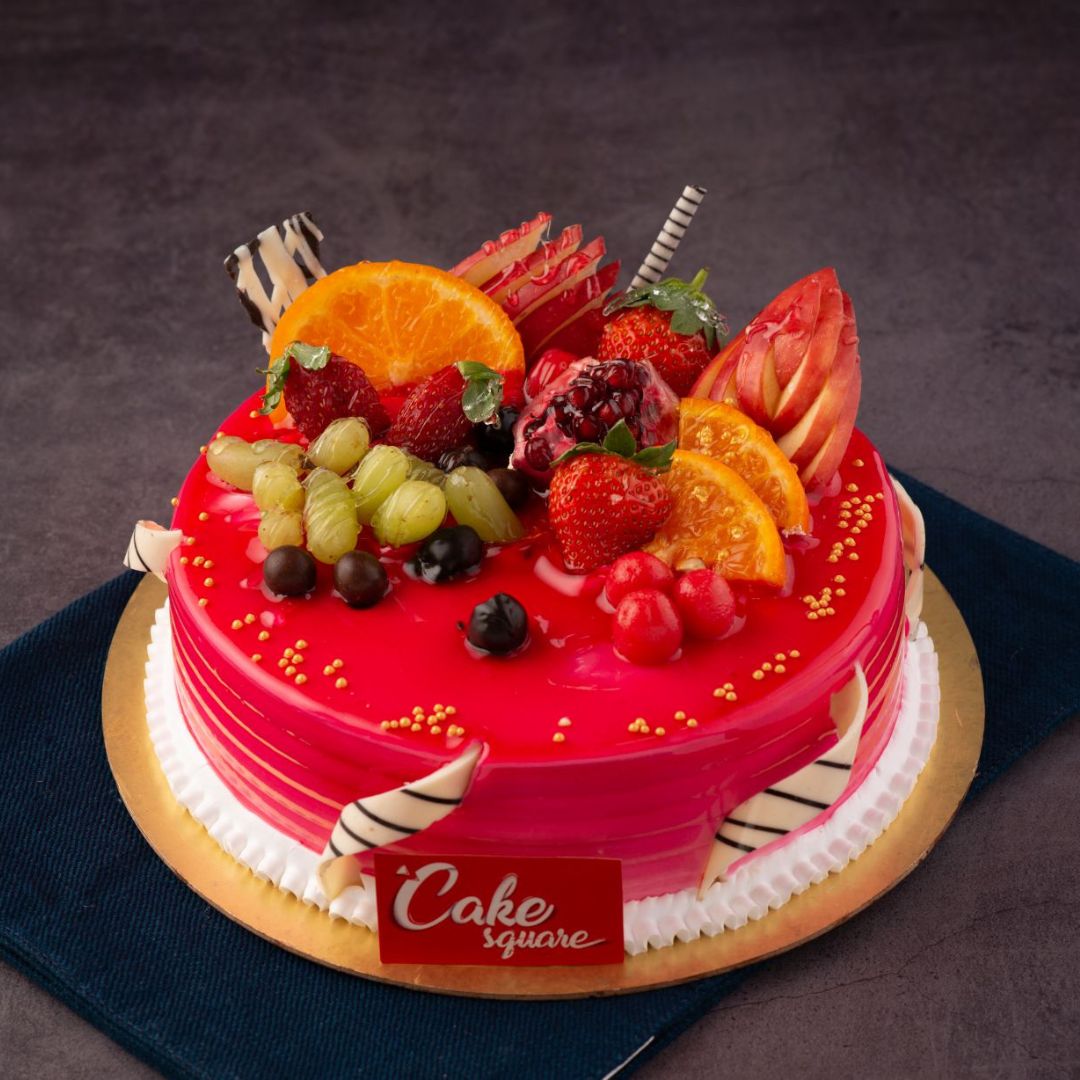 Fresh-fruit-topped-blueberry-mango-birthday-cake